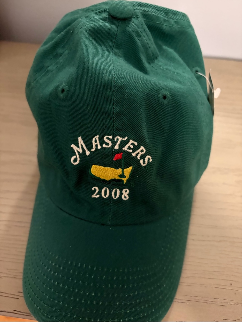 Masters Green Cap with Yellow Logo Tag
